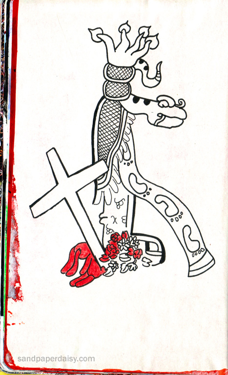 a maya totem depicting a road shown as a ribbon with footprints on it along with a road cross and stuffed bunny erected as a tribute to a fatal road accident