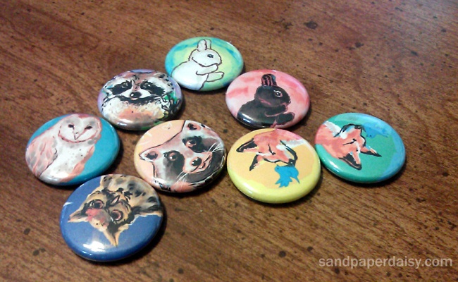 1 inch pinback buttons for art in the wild featuring adorable animals like owls raccoons foxes and rabbits