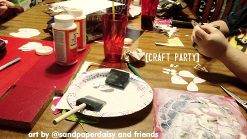 A craft party where my friends are helping me cut out the pieces for a decoupage box turtle and other creatures